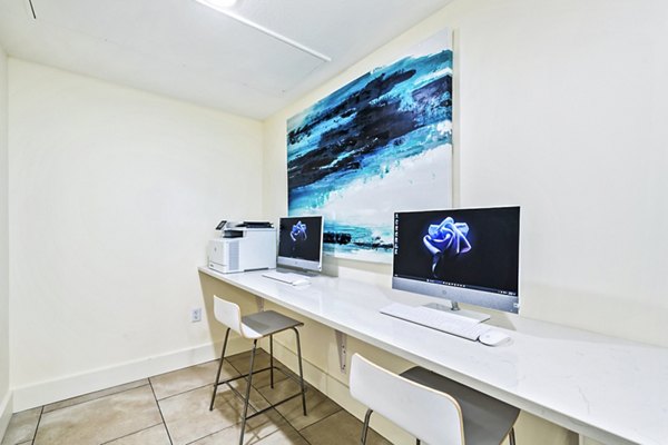 Colonial Court Apartments: Modern clubhouse business center with collaborative workspaces