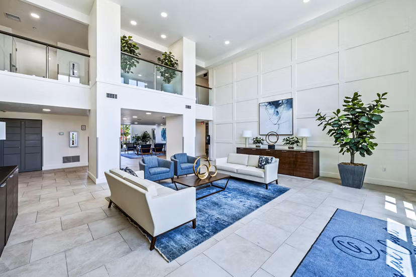 Colonial Court Apartments: Luxurious clubhouse lobby with modern furnishings and elegant design creating a welcoming atmosphere
