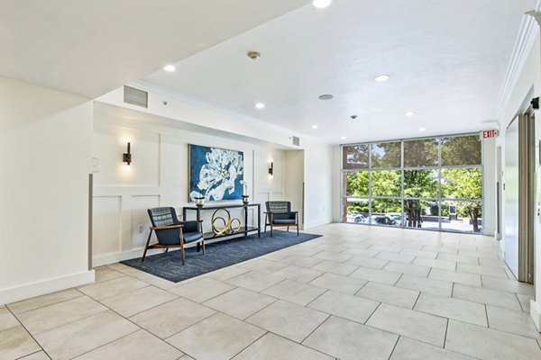 Clubhouse lobby featuring modern decor and seating at Colonial Court Apartments