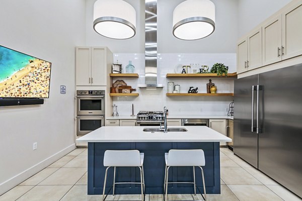Clubhouse kitchen with stainless appliances at Colonial Court Apartments offers luxury living experience