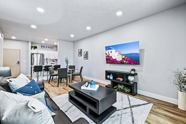 Spacious living room with modern decor in Colonial Court Apartments