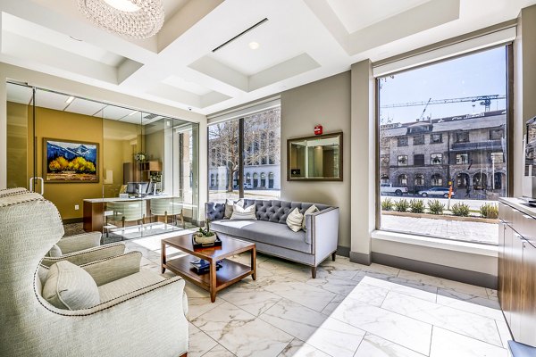 Elegant clubhouse lobby with modern seating and artwork at Eagle Gate Apartments