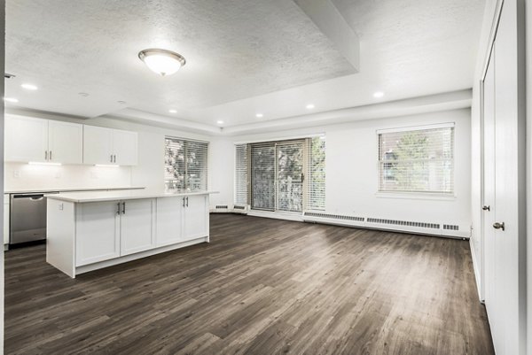 Spacious living room with modern decor and natural light at Eagle Gate Apartments