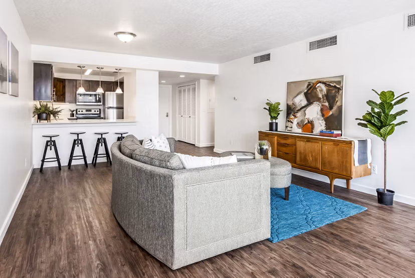 Elegant living room with stylish decor at Eagle Gate Apartments, featuring modern furnishings and large windows