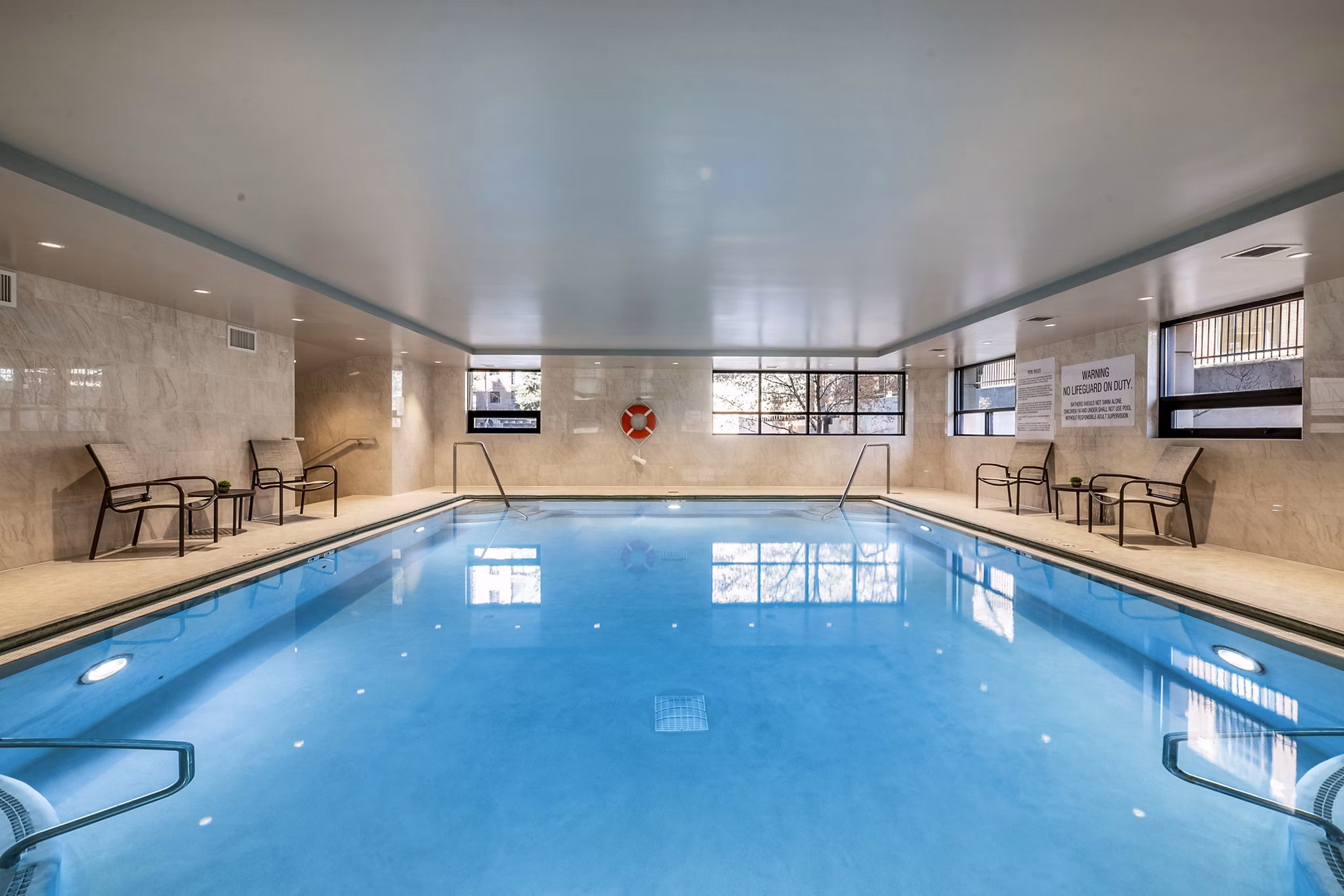 Resort-style pool area at Eagle Gate Apartments offering relaxation and leisure Perfect for residents seeking luxury living amenities