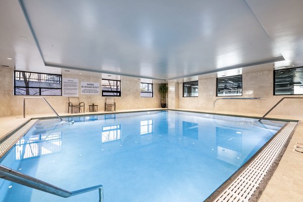 Luxurious pool area at Eagle Gate Apartments with modern design and comfortable lounge spaces for ultimate relaxation