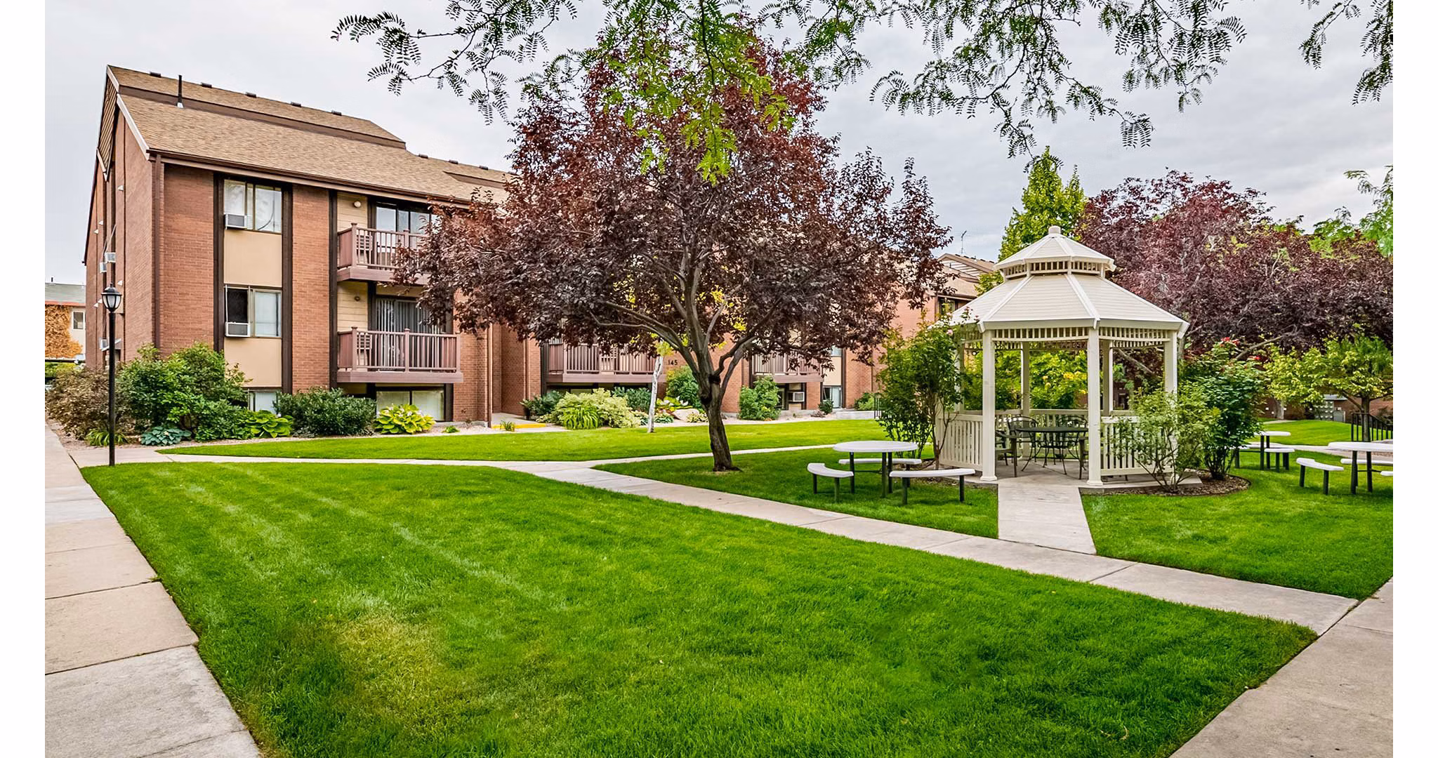 Courtyard with lush landscaping at Garden Apartments, a Greystar luxury community