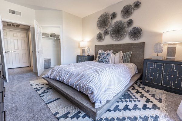 Inviting bedroom with plush bedding and natural light at Avana Coronado Apartments, a Greystar luxury property in scenic location