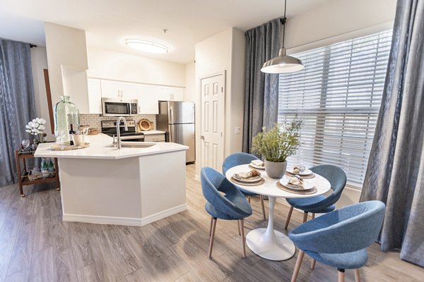 Dining area with modern decor and ample seating at Avana Coronado Apartments