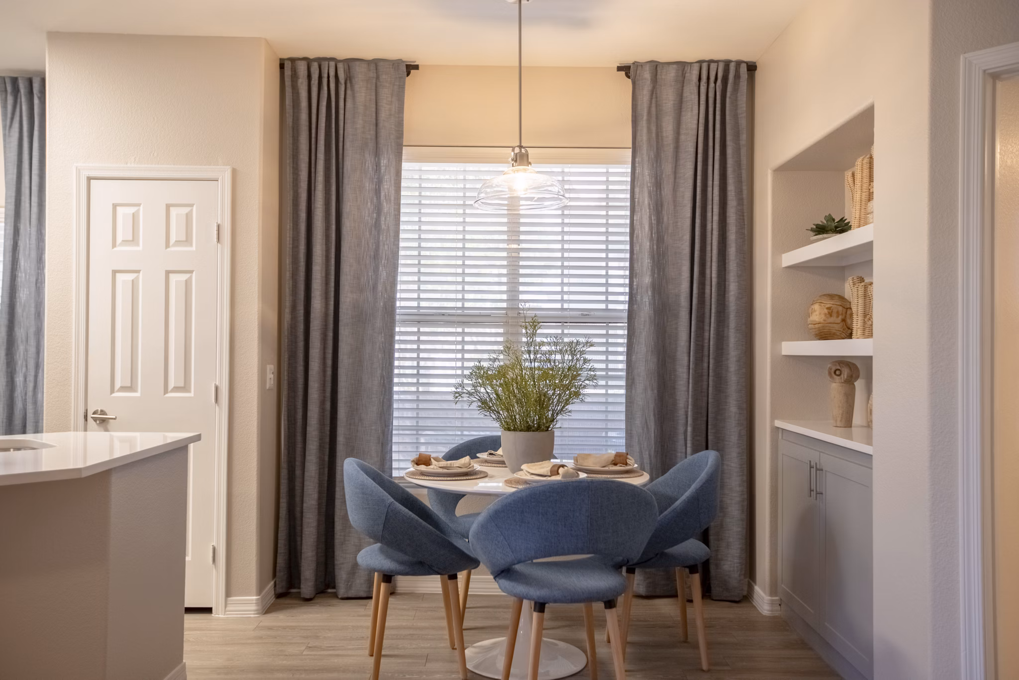 Elegant dining area with modern furnishings at Avana Coronado Apartments