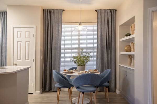 Elegant dining area with modern furnishings at Avana Coronado Apartments