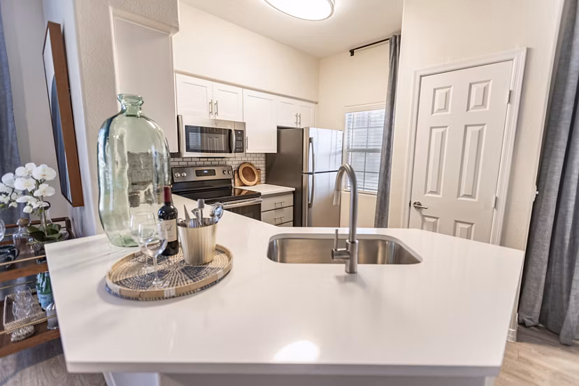 Modern kitchen with stainless steel appliances at Avana Coronado Apartments