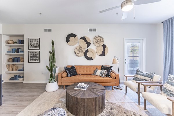 Spacious living room with modern furnishings in Avana Coronado Apartments