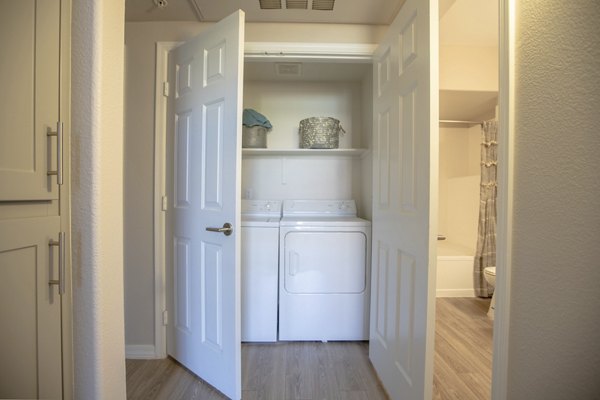 Modern laundry room with stainless steel appliances at Avana Coronado Apartments, a Greystar luxury community in California