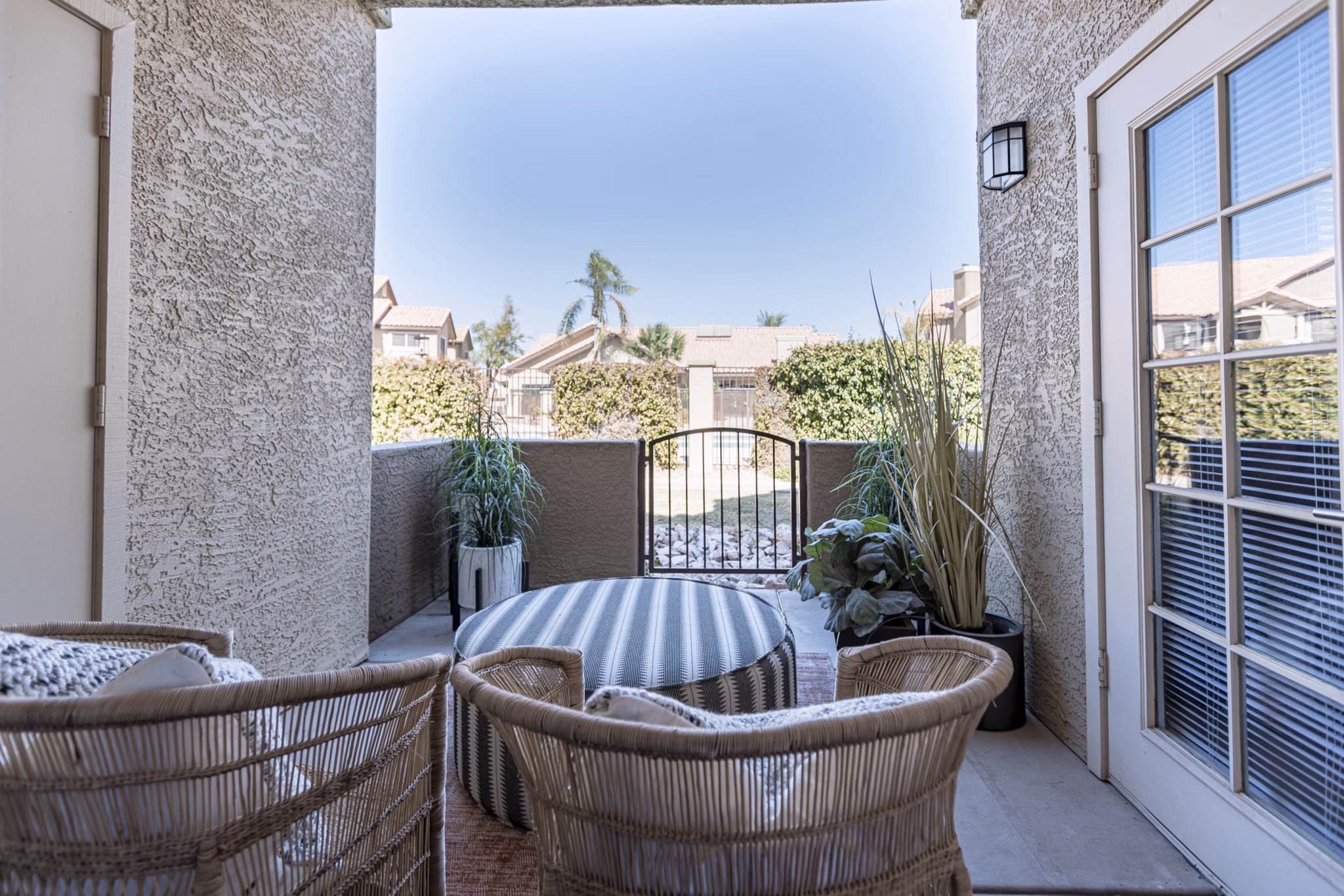 Comfortable patio with modern seating at Avana Coronado Apartments