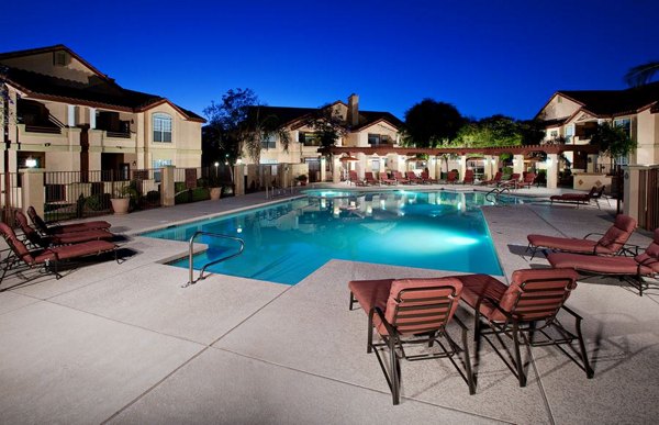 Resort-style pool with lounge chairs at Avana Coronado Apartments, luxury living in a vibrant community