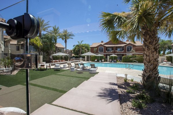 Relax by the sparkling pool at Avana Coronado Apartments, a luxury Greystar community offering premium amenities