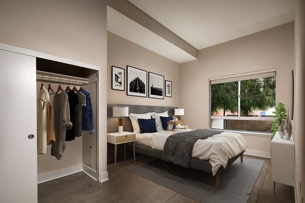 Cozy bedroom with modern decor at Venice on Rose Apartments