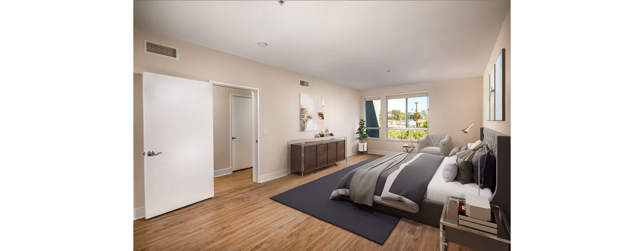 Cozy bedroom with modern decor at Venice on Rose Apartments