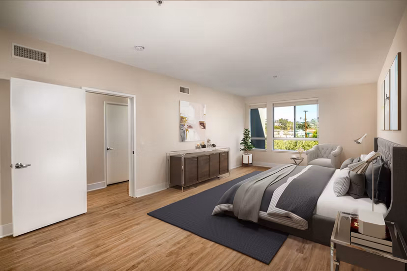 Cozy bedroom with modern decor at Venice on Rose Apartments