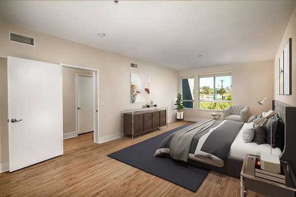 Cozy bedroom with modern decor at Venice on Rose Apartments