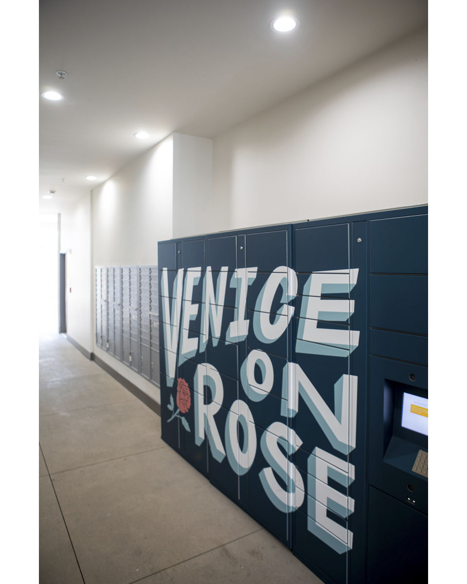 Modern mail room with secure package lockers at Venice on Rose Apartments, luxury living in Los Angeles