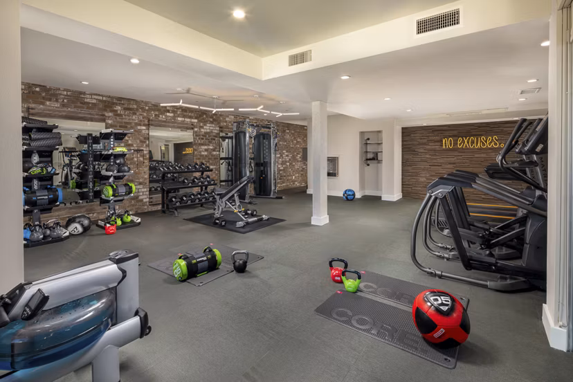Fully equipped fitness center at Venice on Rose Apartments with state-of-the-art equipment and spacious workout areas