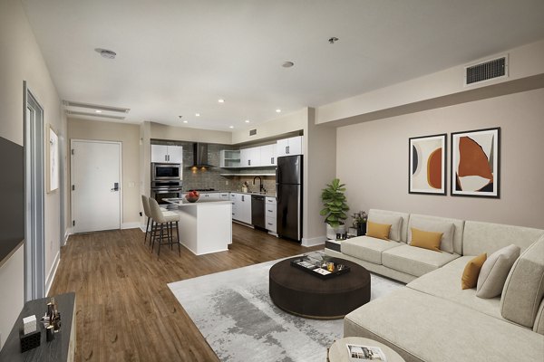Bright living room with modern decor and large windows in Venice on Rose Apartments