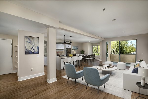 Elegant living room with modern decor in Venice on Rose Apartments, showcasing sleek furniture and natural lighting