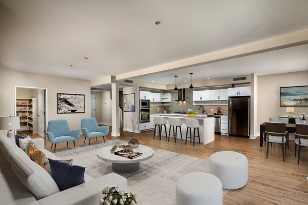 Spacious living room with modern decor at Venice on Rose Apartments, offering luxury living by the beach