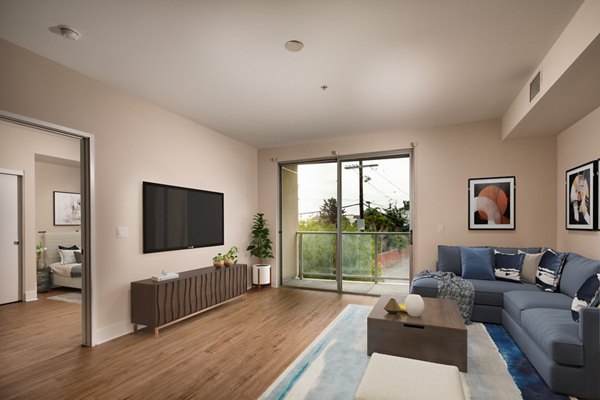 Spacious living room with modern decor at Venice on Rose Apartments