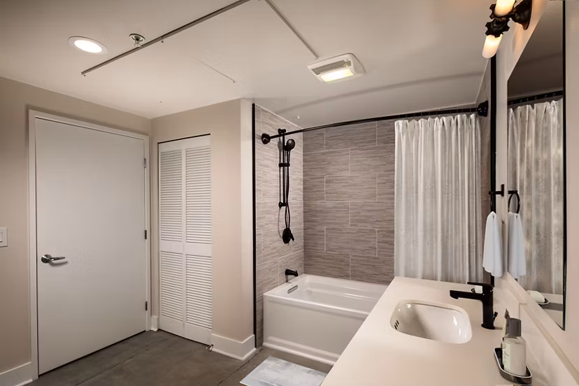 Bathroom featuring modern fixtures at Venice on Rose Apartments