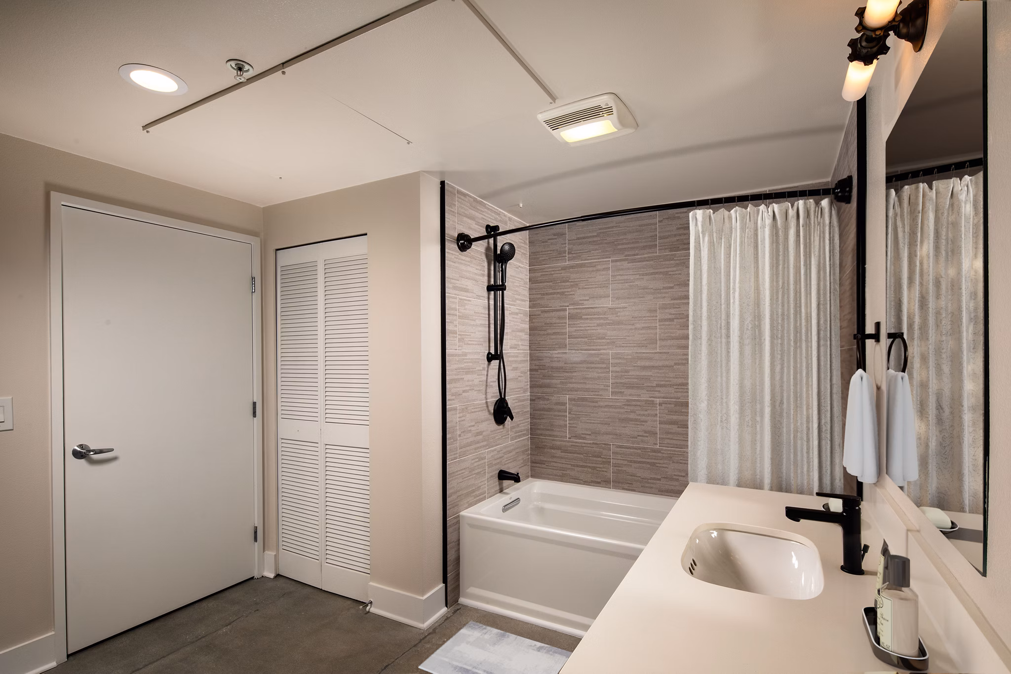 Bathroom featuring modern fixtures at Venice on Rose Apartments
