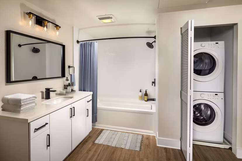 Bathroom featuring marble countertops and modern fixtures at Venice on Rose Apartments