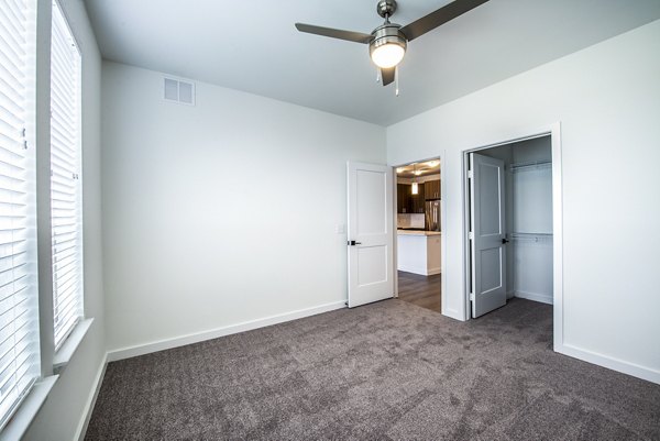 Modern bedroom with cozy decor at The Holston Apartments