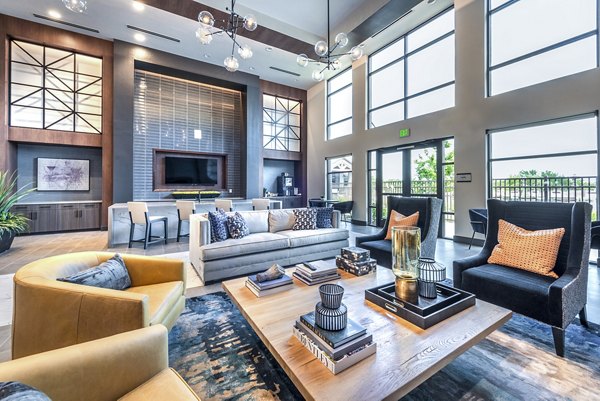 The Holston Apartments: Contemporary clubhouse lobby with modern seating and lighting