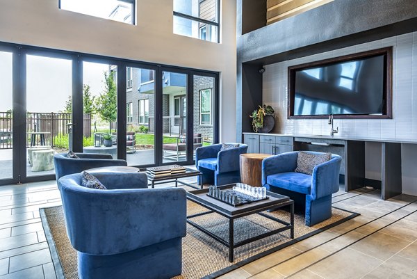 Modern game room with pool table and arcade games at The Holston Apartments, offering luxury living in a vibrant community