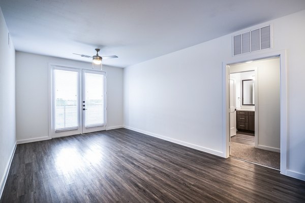 Living room with stylish furniture and natural light at The Holston Apartments, a luxury community offering comfort and elegance