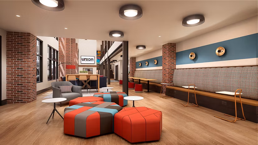 Clubhouse featuring modern design and ample seating at Union on Frank Apartments, a Greystar luxury community