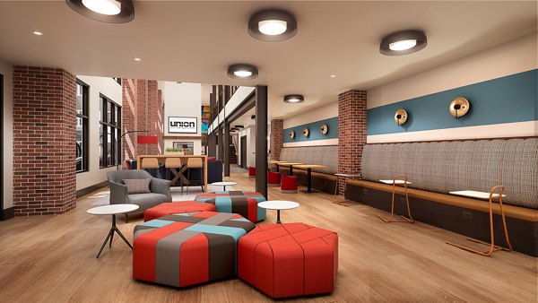 Clubhouse featuring modern design and ample seating at Union on Frank Apartments, a Greystar luxury community