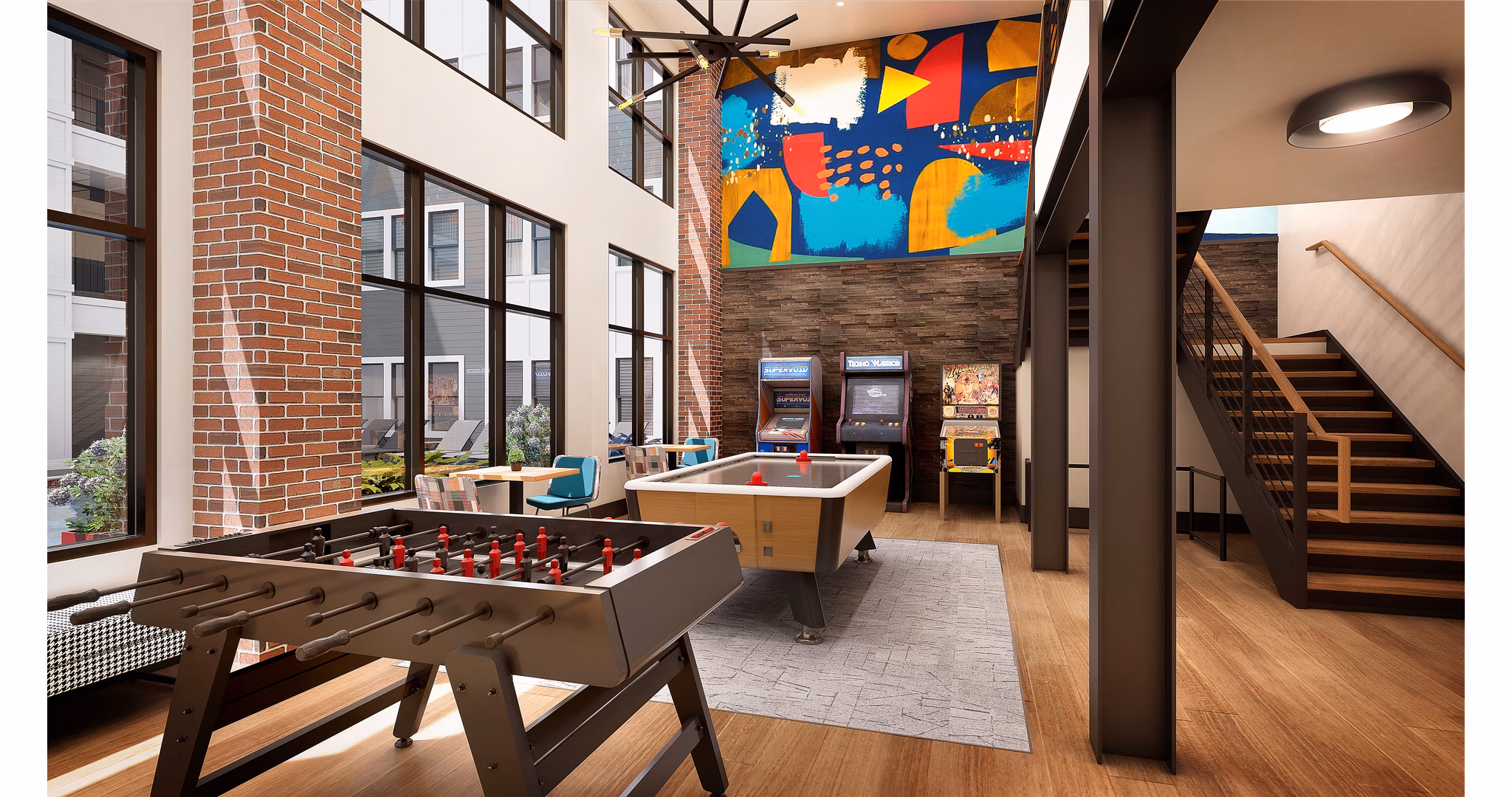 Vibrant game room with pool table and lounge seating at Union on Frank Apartments, perfect for socializing and relaxation