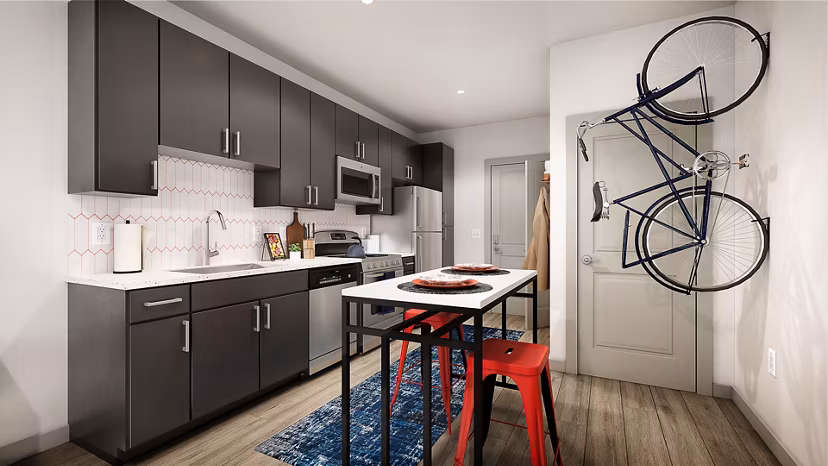 Modern kitchen with stainless steel appliances at Union on Frank Apartments in luxury urban living