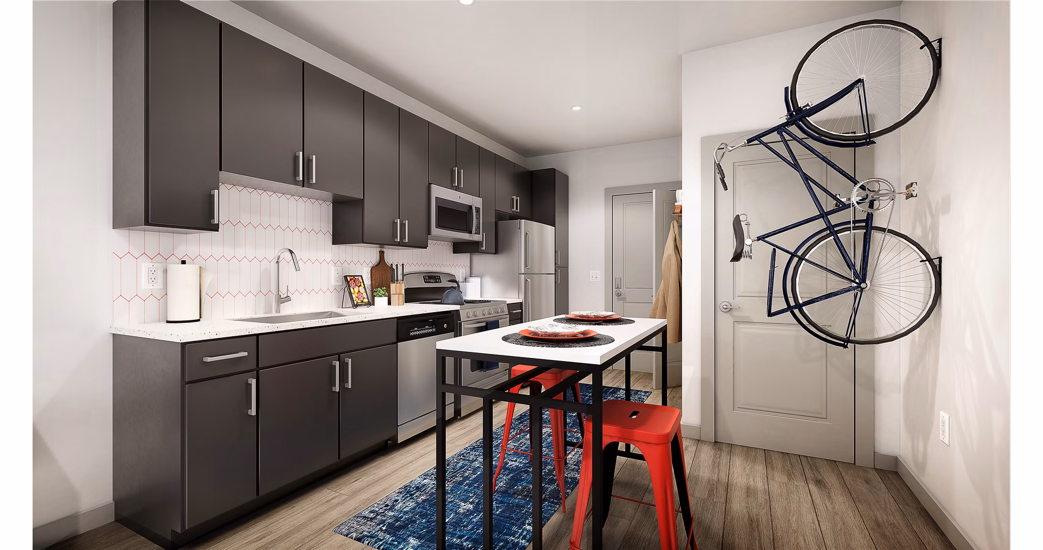 Modern kitchen with stainless steel appliances at Union on Frank Apartments in luxury urban living
