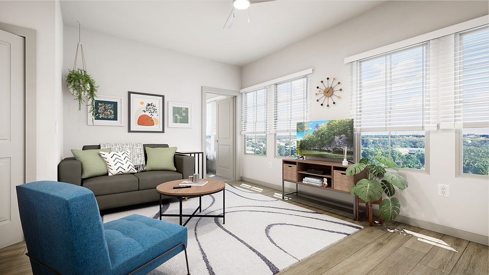 Modern living room with ample seating and natural light at Union on Frank Apartments, ideal for luxury living