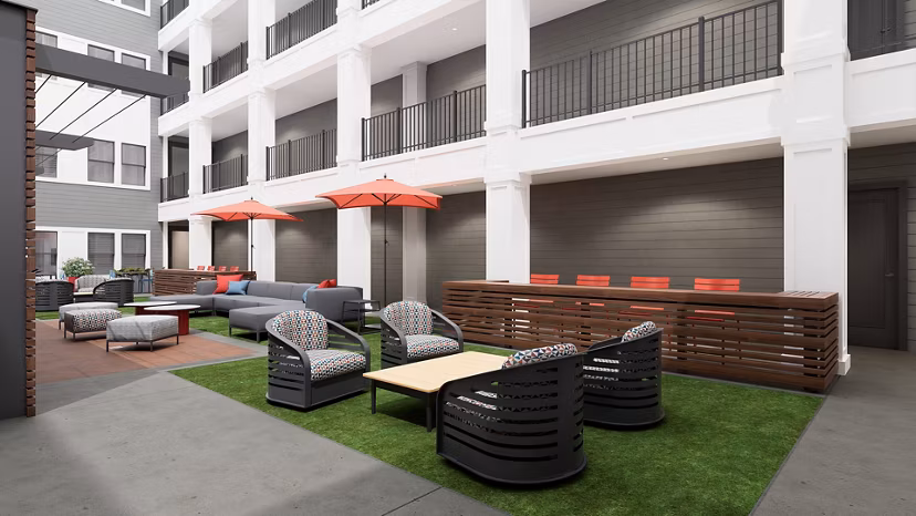 Charming courtyard with lush greenery at Union on Frank Apartments, an upscale community in the heart of the city