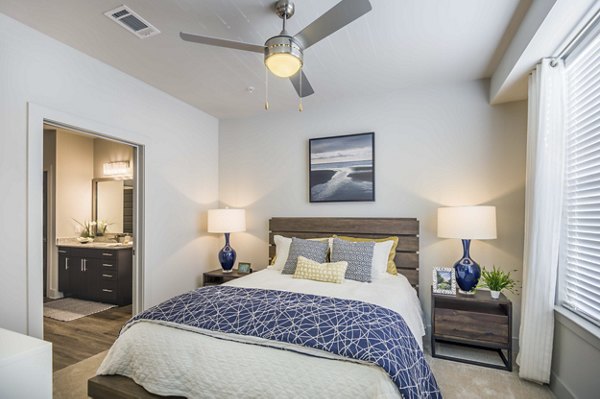 Cozy bedroom with elegant decor at Leigh House Apartments