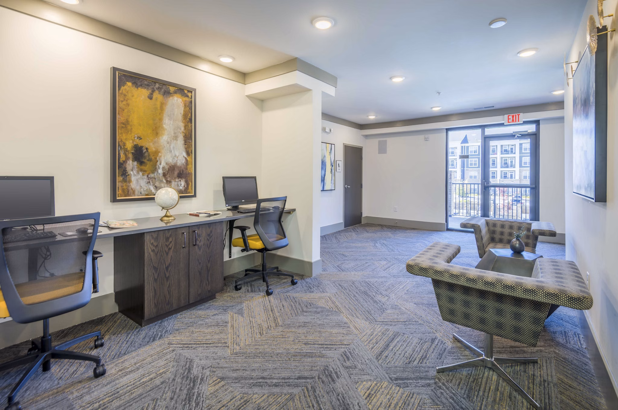 Modern business center with sleek workstations at Leigh House Apartments, providing productive workspaces in a luxury apartment community
