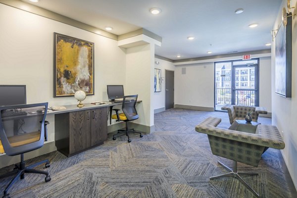 Modern business center with sleek workstations at Leigh House Apartments, providing productive workspaces in a luxury apartment community