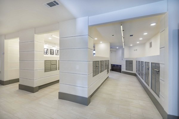Mail room with modern design and secure package lockers at Leigh House Apartments