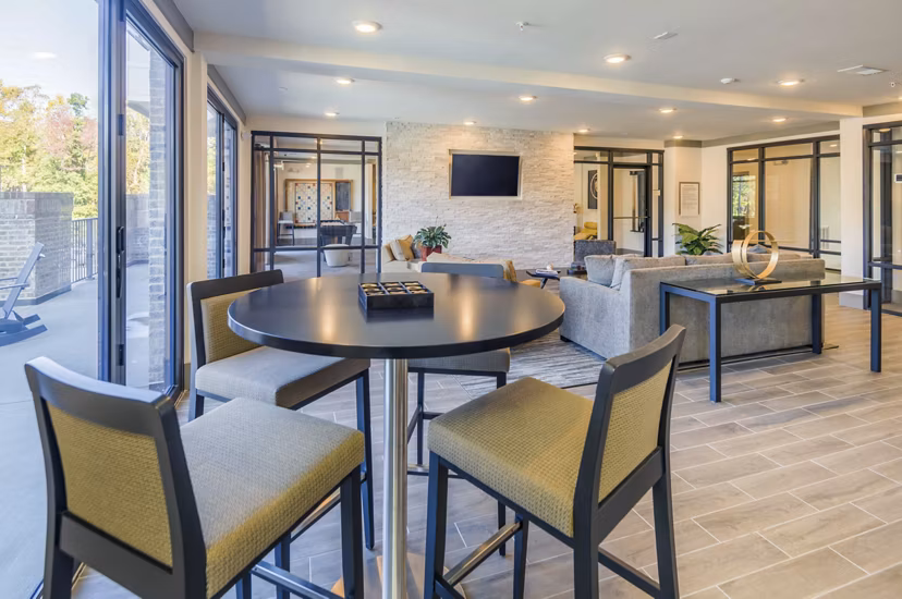 Modern clubhouse featuring a cozy lounge and elegant decor at Leigh House Apartments